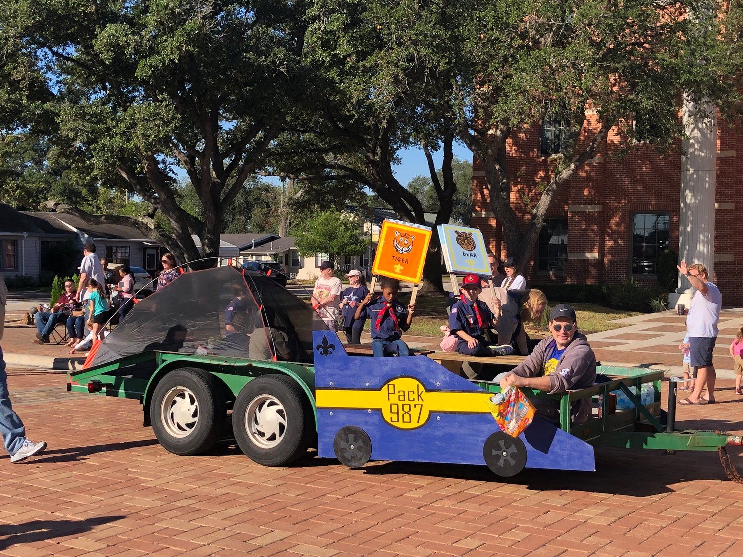 Cub Scout Pack 987 enjoy their ride in the parade.